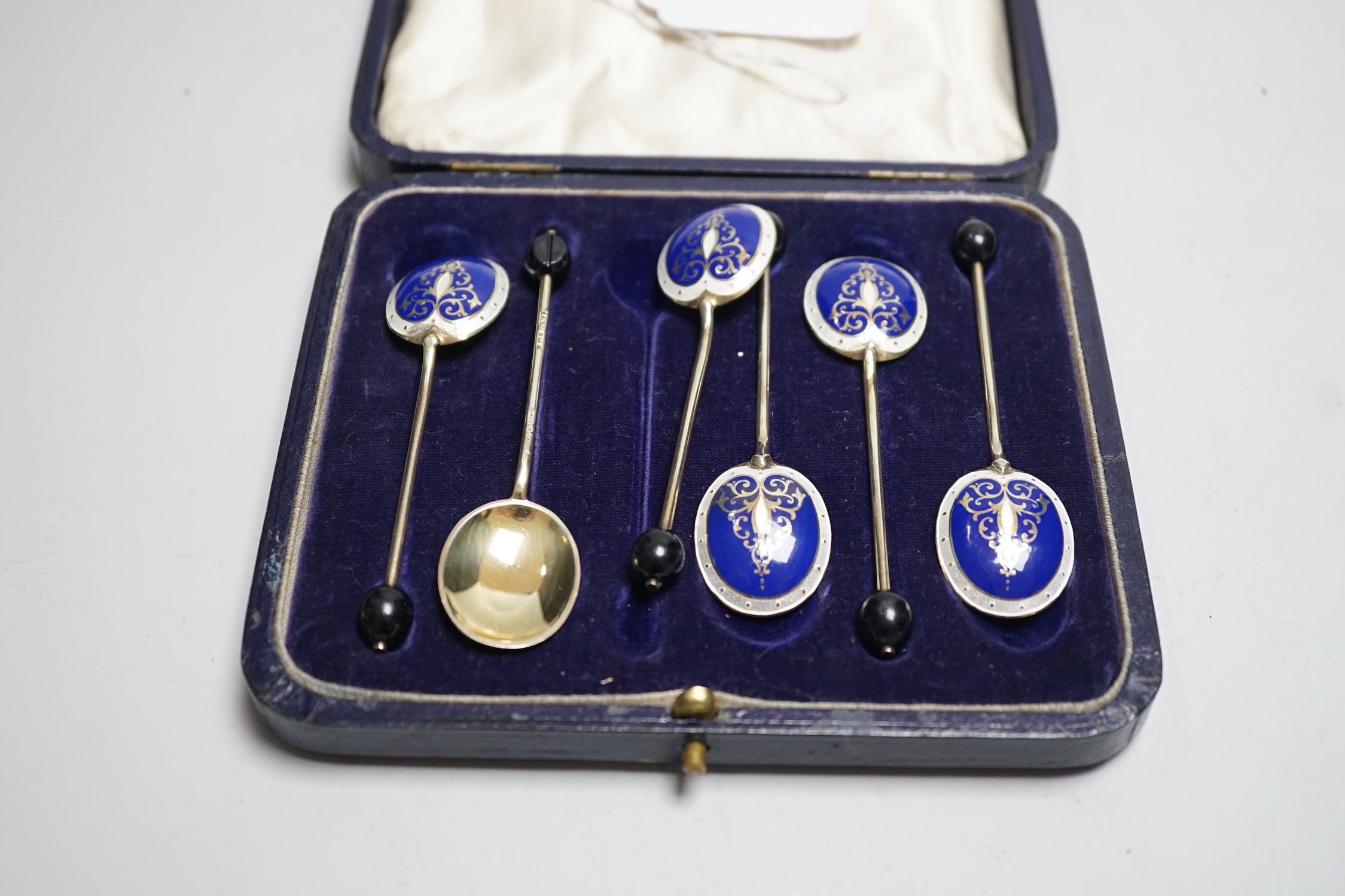 A cased set of six 1950's silver and two colour enamelled coffee spoons by Turner & Simpson.